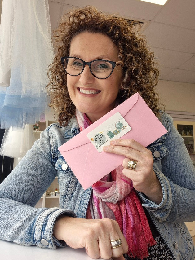 lady holding a lilys adventure letter